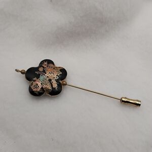 Elegant Black and Gold Floral Brooch